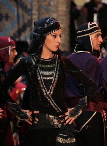 Members of "Rustavi", an ensemble from the Georgia's National Folk Song and Dance Academy, perform in the Old Town section of Tbilisi, May 9, 2005. Georgian culture has a rich history of song and dance that dates back to the first century BC, and is an integral part of modern society. --- Image by © Brooks Kraft/Corbis